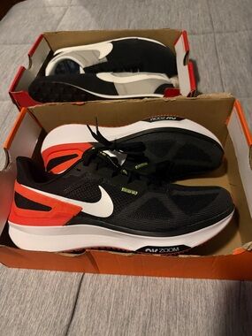 Nike Black Running Shoes with White Swoosh and Orange Accents